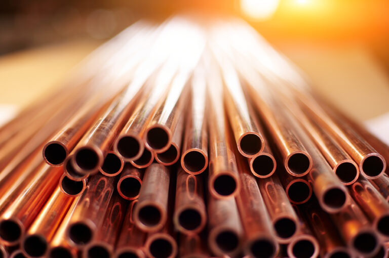 Many,Copper,Pipes,,Warehouse,Copper,Plates